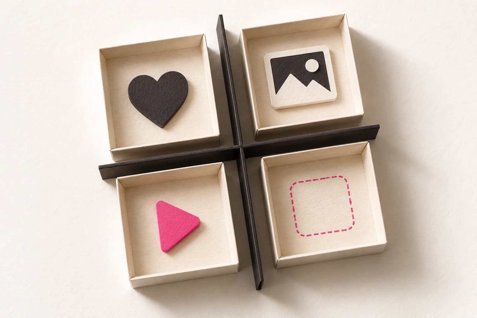 Heart, photo and video symbols occupy separate paper trays beside an empty outlined field.